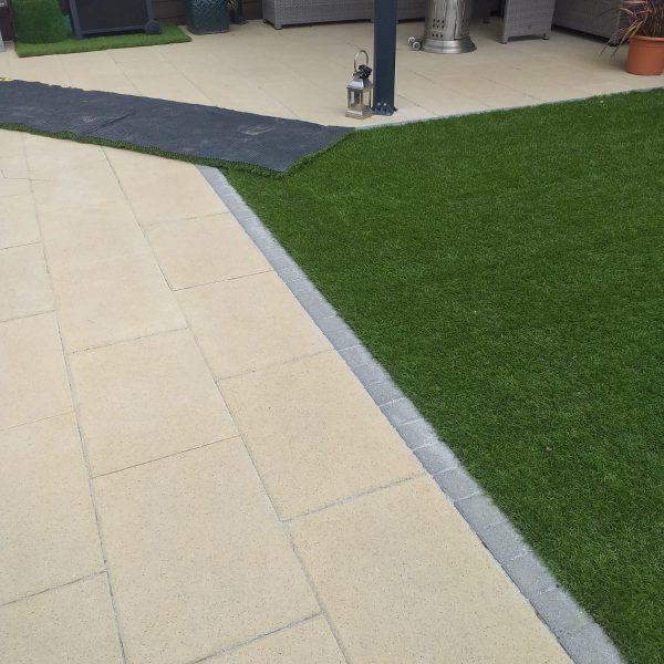 Laying artificial grass